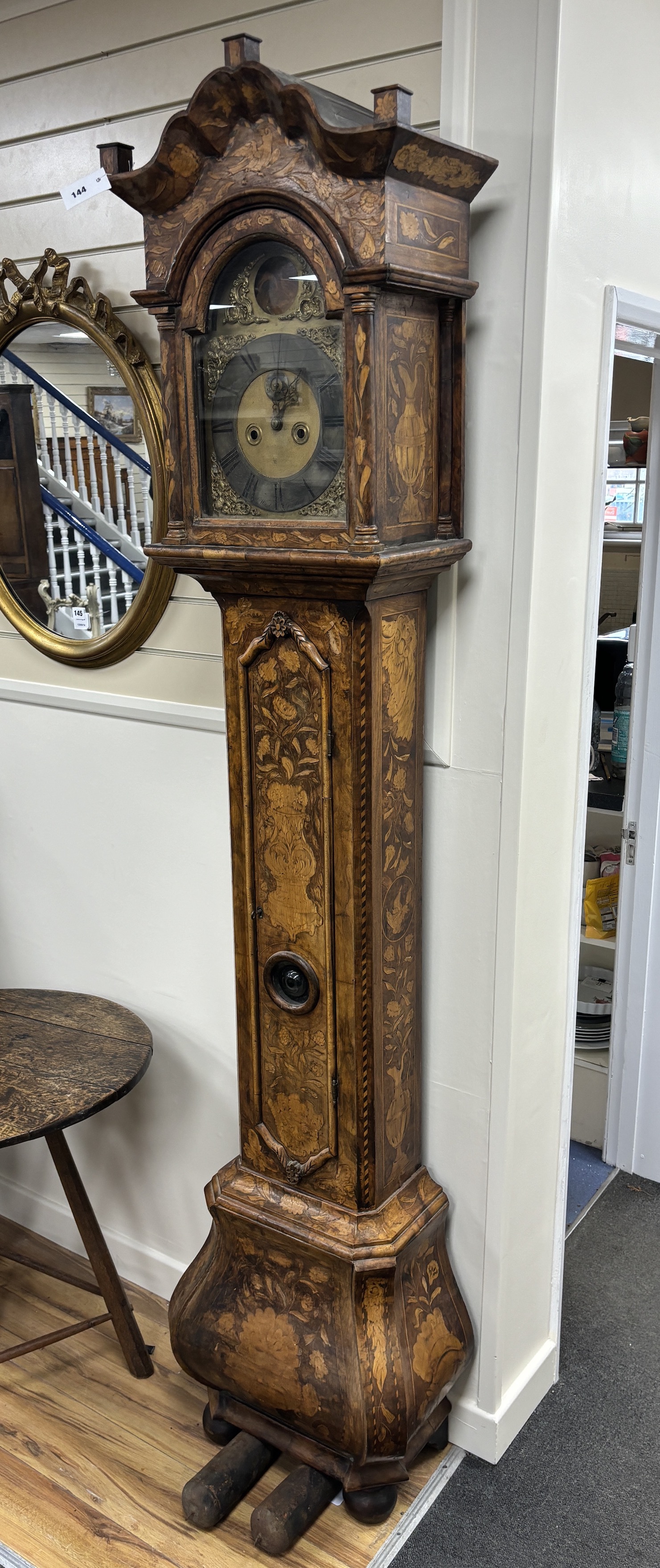 A 19th century Dutch floral marquetry walnut eight day longcase clock, the arched dial marked John Wood, Grantham, height 226cm